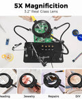 Go-To Hands-Free Soldering Station With Upgraded 5x Magnifying Lamp showing PCB assembly setup with flexible arms.
