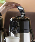 ECAL22S Eco Air Lever Airpot With Glass Vacuum Insulated Beverage Dispenser 2.2 Liter thermal carafe in use, lever pressed