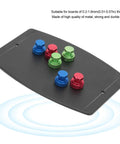 Magnetic Base PCB Holder And Soldering Helper Hands with colorful electromagnetic pins on a flat metal surface for electronics repair.