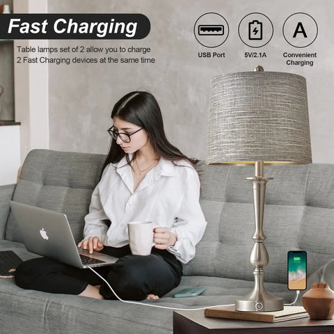 USB Sleek Metal Table Lamps Set Of 2 For Living Room And Bedroom Large Size Brushed Nickel Finish Touch Activated Dual USB Ports On Base Charge Phones Tablets And More Even When Lamps Are Off with woman using laptop
