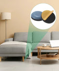 20-Pack Furniture Sliders With Self Adhesive PTFE Pad Mover Glides For Chair Kitchen Appliances And Round Floor Protectors In Grey heavy duty pads displayed near a grey sofa.