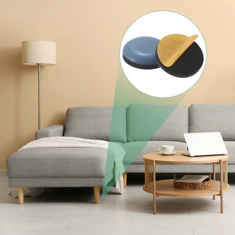 20-Pack Furniture Sliders With Self Adhesive PTFE Pad Mover Glides For Chair Kitchen Appliances And Round Floor Protectors In Grey heavy duty pads displayed near a grey sofa.