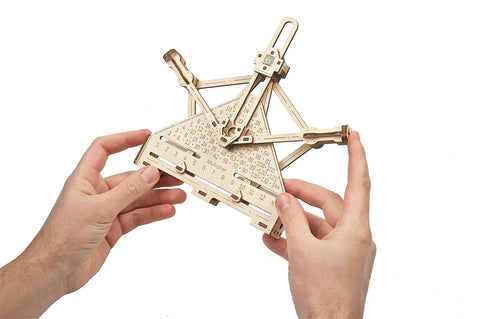 Hands holding STEM Arithmetic 2 In 1 Wood Mechanical Puzzle Kit For Adults DIY Science Model Set With Augmented Reality App Learn Mechanical Adder And Multiplier Educational Engineering 3D Puzzles
