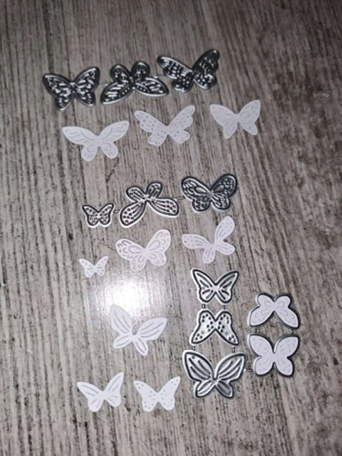 11 Piece Butterfly Metal Die Cuts Set For DIY Cards Scrapbooking And Embossing Frames Wedding Stencils on wood surface