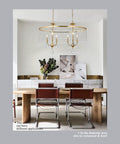 Lit 6 Light Gold Crystal Chandelier With K9 Crystals And Warm Gold Frame above dining table in modern room.