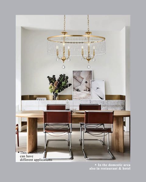 Lit 6 Light Gold Crystal Chandelier With K9 Crystals And Warm Gold Frame above dining table in modern room.