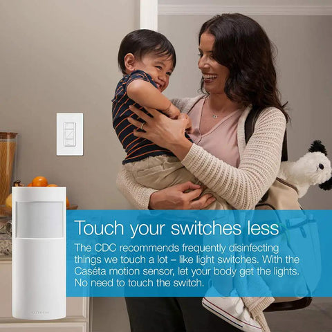 Woman holding child next to Smart Motion Sensor For Dimmers, Switches, And Fans With Auto On Off Lighting, No Wires Required, White