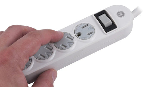 Person using Four Outlet Power Strip With 1.5 Foot Extension Cord Twist To Lock Safety Covers Built In Circuit Breaker UL Listed White