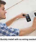Person installing Outdoor Wireless Security Camera Battery Powered 2.5K FHD Color Night Vision With Motion Detection And Spotlight