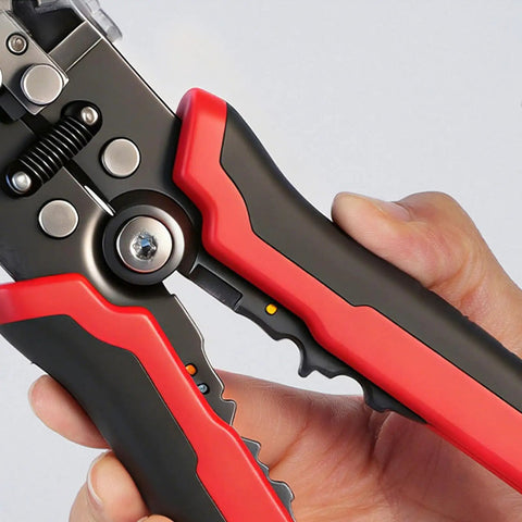 Close-up of All In One Wire Stripper And Cutter For Electricians And DIY Handymen with ergonomic red and black handles.