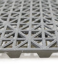Close-up of gray 12 Pack Modular Interlocking Cushion Rubber Floor Mats 11.6 Inch Square Tiles showing drainage design.