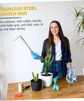 Woman showcasing Stainless Steel Gardening Hoe With Anti Skid Rubber Grip Lightweight Yet Sturdy Hand Tool For Quick Weeding