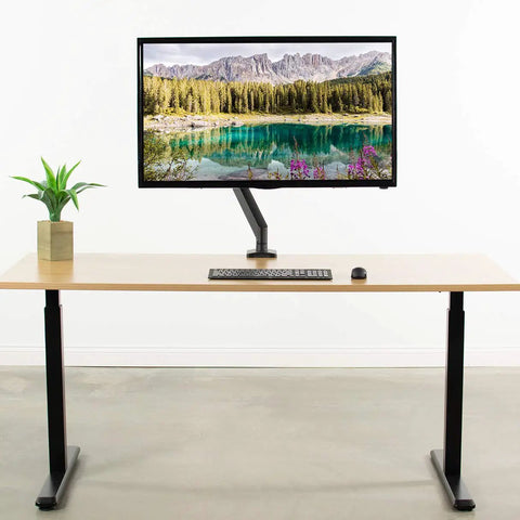 Built Tough VESA Adapter Bracket For TVs And Monitors Max 42 Inches, heavy-duty mount holding a monitor on a modern desk.