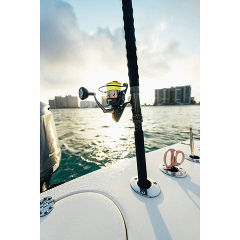 Battle III Inshore Spinning Reel with HT-100 Front Drag, 12 lb max drag, aluminum, saltwater ready, black gold finish, on boat
