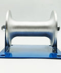 Front view of 7.8 Inch Pipe Feeding Sheave And Cable Puller Sheave Workhorse Rugged Cable Pulley on a blue base