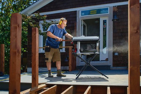 Heavy Duty Compact Table Saw With Patented Skin Contact Safety System and Precision Rack Pinion Fence in use on job site.