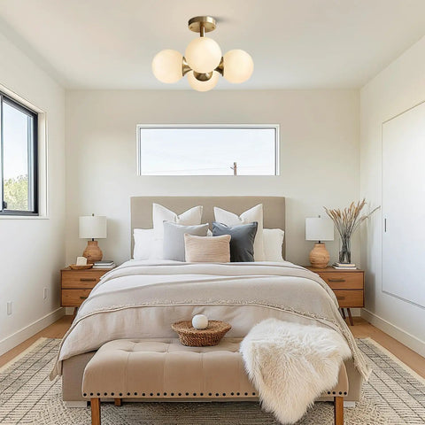 Antique Brass 4 Light Ceiling Light With Frosted Glass Globes, Mid Century Modern Chandelier in a cozy bedroom setting