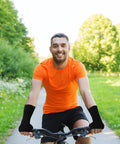 Cyclist wearing set of four unisex fingerless compression gloves with wrist support for sports thumb protection in black