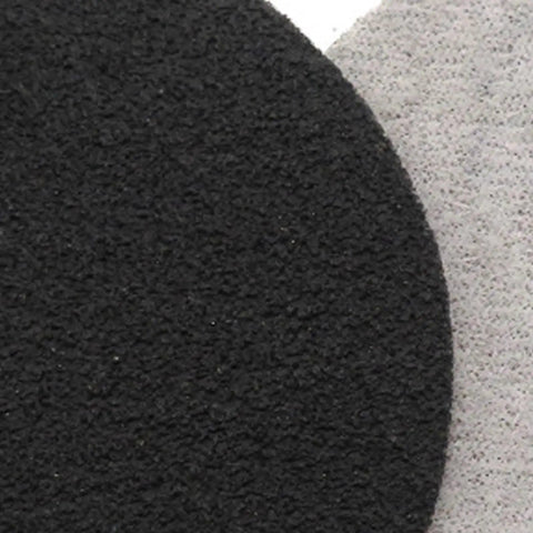 Close-up of Solid 30 Pack Of Carbon Silicone Sanding Discs showing textured black surface, for auto metal wood polishing.