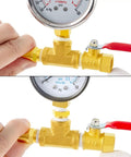 One Quarter Inch NPT Brass Pipe Fitting Kit With Two Ball Valves, Two Hex Bushings, pressure gauge, and hose fitting in use