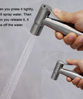Two Pack Stainless Steel Handheld Bidet Spray Heads For Bathroom And Toilet Cleaning 8 Lpm Water Flow Durable 304 Stainless Steel Excludes T Valve Hose Holder Tape, shown in hand with water spray.