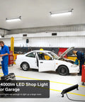 Legit Heavy Duty Led Shop Lights 100W 14000 Lumen Knockout Brightness 6500k Daylight White Bulbs Ip66 Waterproof Garage Lamps Plug And Play Workshop Fixtures Two Pack Bundle in a garage with mechanics.