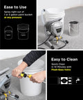 Heavy Duty Airless Paint Sprayer Pumping 3000 Psi 0.31 Gpm next to 1 and 5 gallon paint buckets for easy use.