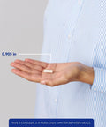 Hand holding a single capsule of Calcium Citrate Daily Go-To Supplement For Bone Teeth Colon And Heart Health Premium 180 Count, size 0.905 inches.