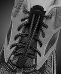 Close-up of quick tie shoelaces using 25 Pack Zipper Pull Tabs And Cord End Caps For Shoes And Bags 3.5mm Ends Cord Lock Clips End Tips Replacement.