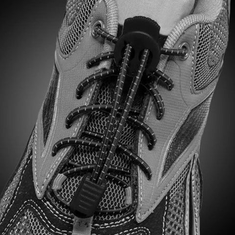 Close-up of quick tie shoelaces using 25 Pack Zipper Pull Tabs And Cord End Caps For Shoes And Bags 3.5mm Ends Cord Lock Clips End Tips Replacement.