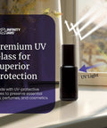 Black Ultraviolet Glass Roller Bottle 15 Ml Essential Oil Bottle With Glass Ball Roll On Tip next to a window with UV light.