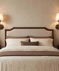 YS.ESUDSI Vintage Wall Sconces with White Fabric Shade Hardwired E26 Base mounted beside a stylish bed in a cozy bedroom.