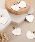 Front view of heart-shaped stainless steel pendant charms with snap-on bails, 33mm for DIY jewelry making