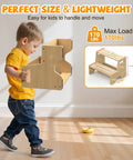 A child holding the Straight Up Solid Two Pack Wooden Step Stool For Toddlers, lightweight and easy to move, supports 170 lbs.