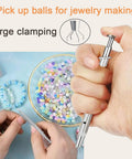 Hand using a ball grabber tool for jewelry making, part of the Piercing Taper Kit For Threadless And Internal Threaded Jewelry Changing Tools.