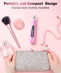 Beast Mode Heavy Duty Electric Nail Drill And Cordless Nail File Rechargeable Professional Manicure Kit With Ten Grinding Heads For Flawless Gel Removal And Salon Grade Home Pedicures Rose Pink on a pink background with cosmetics.