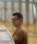 Man wearing Tacana ANSI Z87.1 Safety Glasses for Men With Anti Fog Lenses Built For The Daily Grind in a workshop setting.