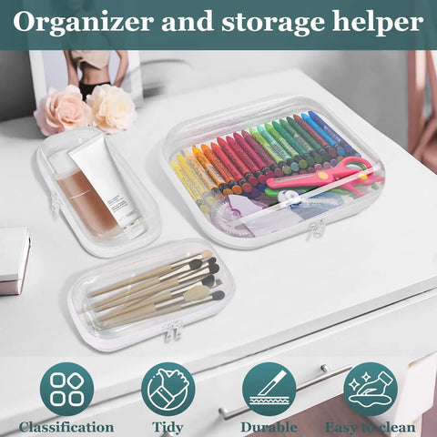 Clear Hard Shell Zipper Cases Set Of Three 2 Small And 1 Medium Durable PET Plastic Pencil Case And Diaper Bag Organizer For Storage Travel And Spill Protection See Through Pouches on a desk with art supplies inside.