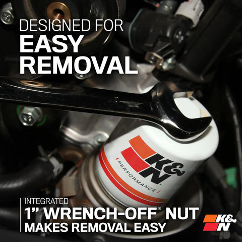 Top Notch Premium Oil Filter With Wrench Off Nut installed in engine, highlighting easy removal with integrated nut
