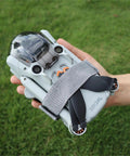 Hand holding drone secured with All Purpose Elastic Nylon Propeller Strap Kit No Fuss For Mini 5 Pro Mini 4K Mini 3 Mini 3 Pro Mini 4 Pro