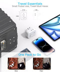 Image showing Compact Cube Power Strip With Three USB Ports And USB C Non Surge Protector next to a suitcase and phone.