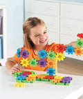 Child playing with Learning Resources Gears Starter Building Set For STEM Activities And Fine Motor Skill Development Totally Kid Friendly Toddler Explorer Kit For Science And Construction Ages 3 And Up Perfect Gift For Boys And Girls, colorful 60-piece set on table.