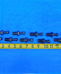 Rock Solid Cat40 Mas3 Retention Knobs And Pull Studs 10 Piece Lot For Cnc Mill Machine Tooling set of steel knobs on blue background.