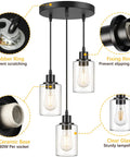 Industrial Three Light Pendant Light With Adjustable Height Up To 34 Inches, black finish, clear glass shades, E26 base, three bulbs.