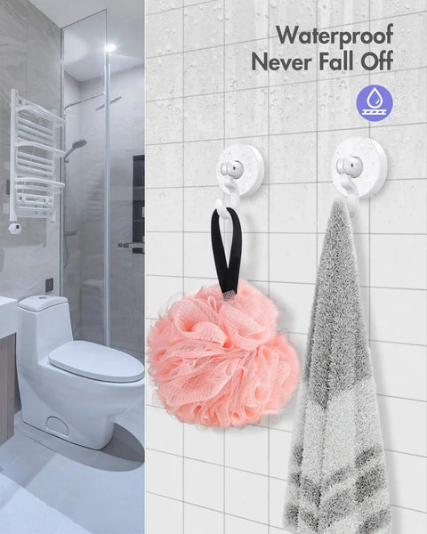 Bathroom with Heavy Duty No Drill Adhesive Hooks Set 3 Pound Capacity Damage Free White 6 Pack holding towel and shower puff on tiles.