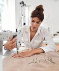 Woman sewing with machine, Stainless Steel Embroidery Scissors Set 2 Pcs 3.6 Inch Gold Tone Small Shears lying on table