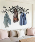 Upgrade Your Space With This Super Sturdy Scroll Metal Coat Rack And Grab A Quick Jacket On This Dang Good Looking Wall Mounted Hat Rack. Elegant black scroll coat rack holding light jackets and a handbag.