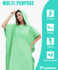 Model wearing Hooded Towel Changing Poncho for Surfing and Outdoor Adventures, featuring front kangaroo pocket, in green color.