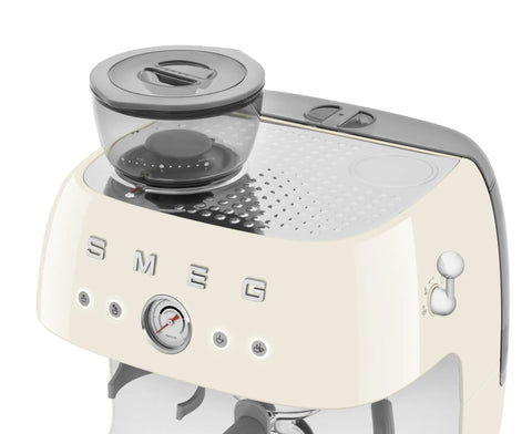 Top Shelf Semi Automatic Espresso Machine With Built In Conical Burr Grinder Dual Thermoblock Heating Precision Controls And Authentic 1950s Retro Vibe In Smooth Cream Finish, close-up view of top with grinder.