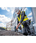 Professional Brushless 18 Volt Cordless Drill Driver Featuring 150 Nm Beast Mode Torque And Heavy Duty Rugged Build To Slam Through Any Worksite Project Today Without Breaking A Sweat being used by a construction worker.